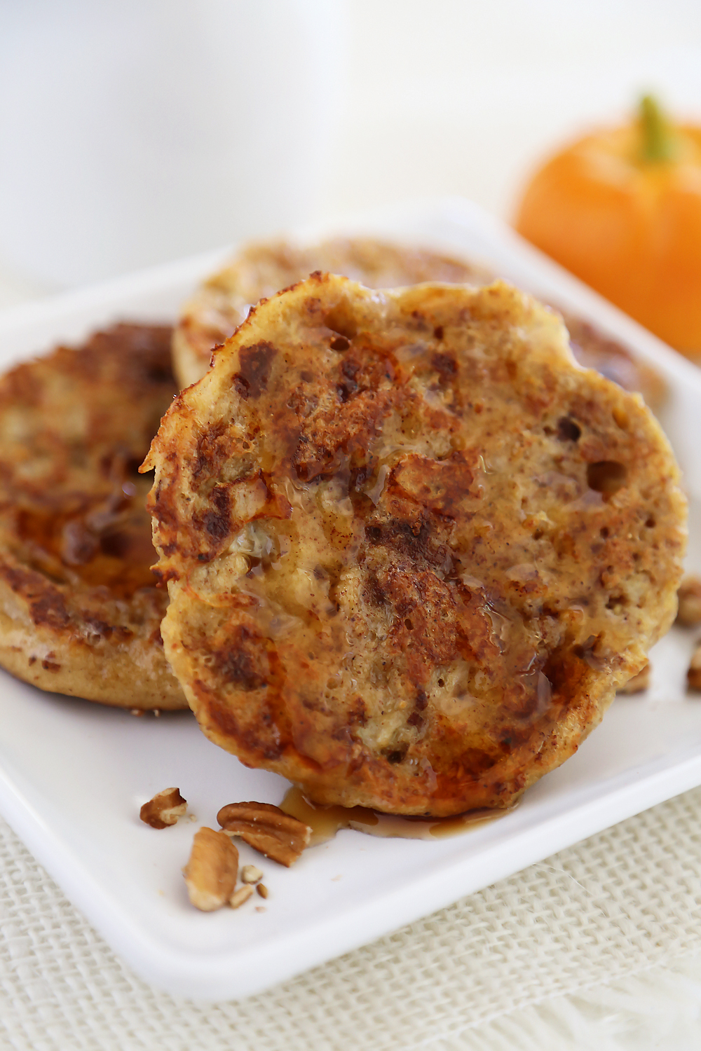 Pumpkin Vanilla English Muffin French Toast - Fluffy, buttery French toast made with pumpkin spice English muffins, vanilla, cinnamon and nutmeg! Thecomfortofcooking.com