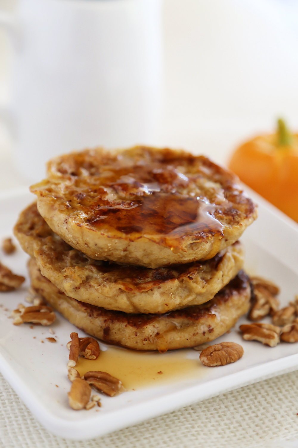 Pumpkin Vanilla English Muffin French Toast - Fluffy, buttery French toast made with pumpkin spice English muffins, vanilla, cinnamon and nutmeg! Thecomfortofcooking.com