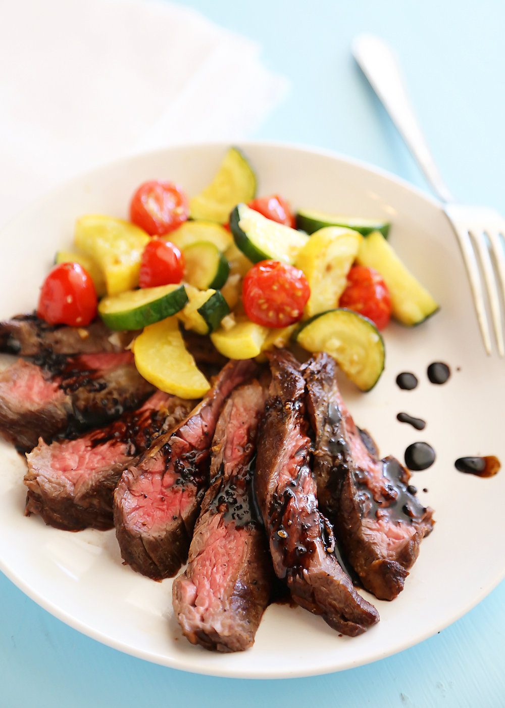 Skillet Balsamic Skirt Steak with Garlic Zucchini, Squash and Tomatoes - Melt-in-your-mouth tangy, tender steak dinner with veggies, easily made in one skillet! Thecomfortofcooking.com