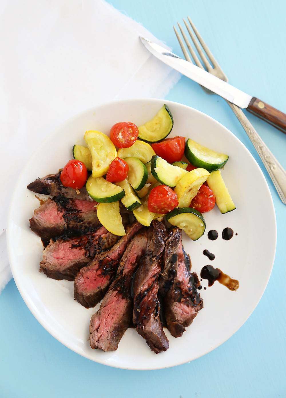 Skillet Balsamic Skirt Steak with Garlic Zucchini, Squash and Tomatoes - Melt-in-your-mouth tangy, tender steak dinner with veggies, easily made in one skillet! Thecomfortofcooking.com