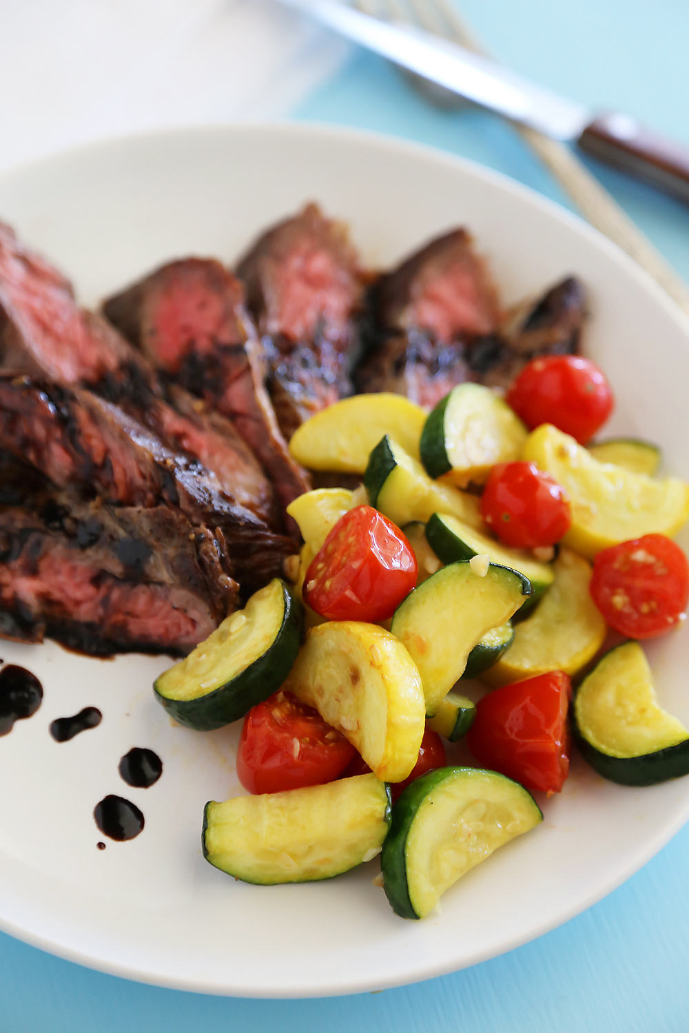 Skillet Balsamic Skirt Steak with Garlic Zucchini, Squash and Tomatoes - Melt-in-your-mouth tangy, tender steak dinner with veggies, easily made in one skillet! Thecomfortofcooking.com