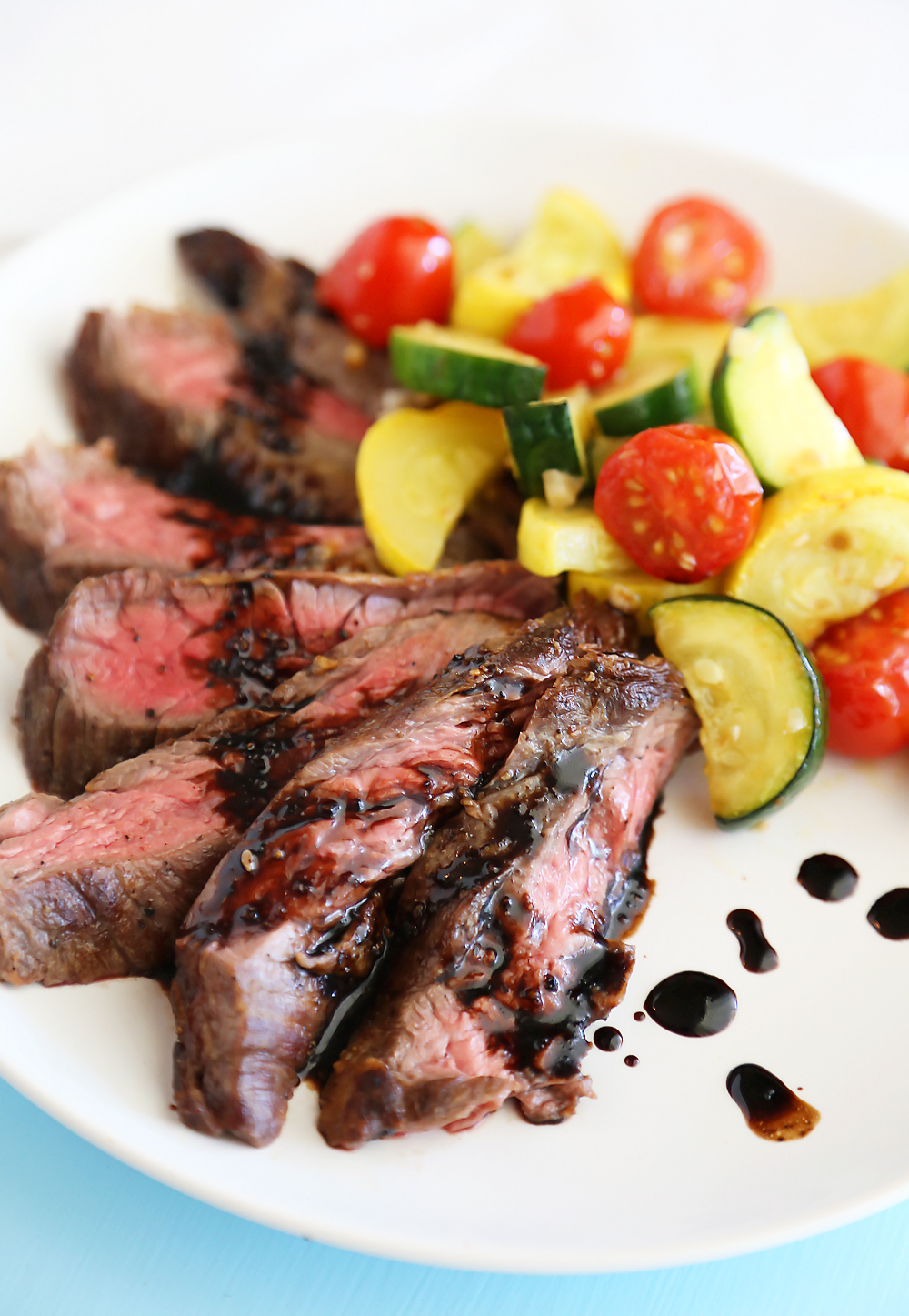 Skillet Balsamic Skirt Steak with Garlic Zucchini, Squash and Tomatoes - Melt-in-your-mouth tangy, tender steak dinner with veggies, easily made in one skillet! Thecomfortofcooking.com