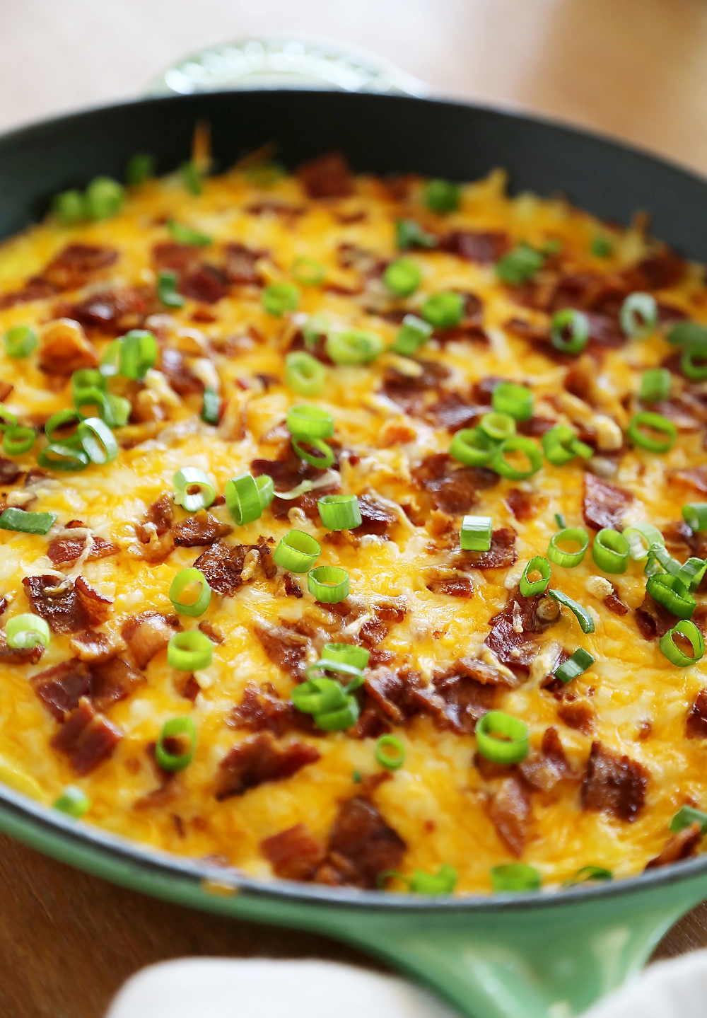 Cheesy Bacon Potato Frittata - Easy bacon-egg-cheddar frittata with potato crust makes a mouthwatering meal anytime of day! Thecomfortofcooking.com