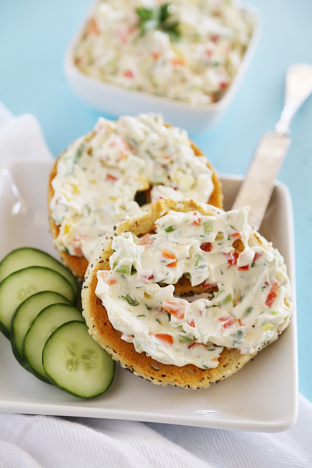 Whipped Garlic Veggie Cream Cheese – So easy and versatile! Spread on toasted bagels, or mix in to pasta sauce for decadent creaminess. Thecomfortofcooking.com