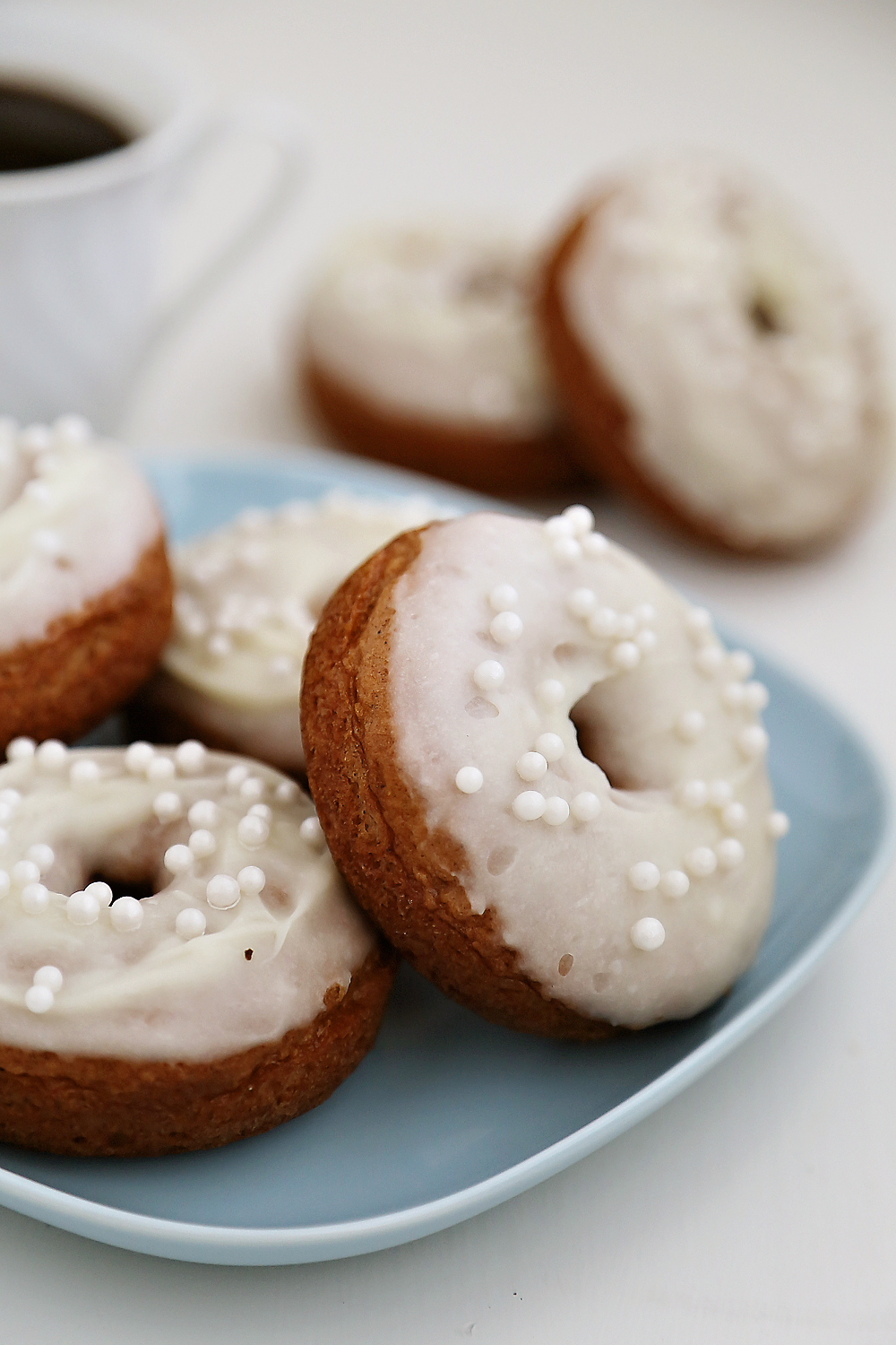 Soft Pumpkin Donuts with Cream Cheese Glaze - Super soft, spiced pumpkin donuts are so fragrant, simple and scrumptious. Baked not fried! Thecomfortofcooking.com