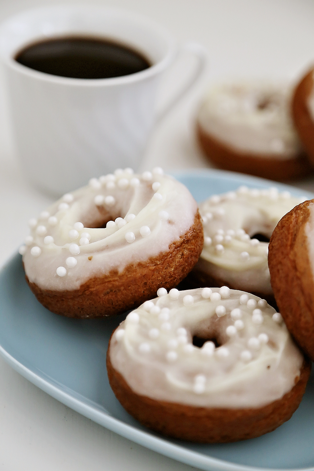 Soft Pumpkin Donuts with Cream Cheese Glaze - Super soft, spiced pumpkin donuts are so fragrant, simple and scrumptious. Baked not fried! Thecomfortofcooking.com