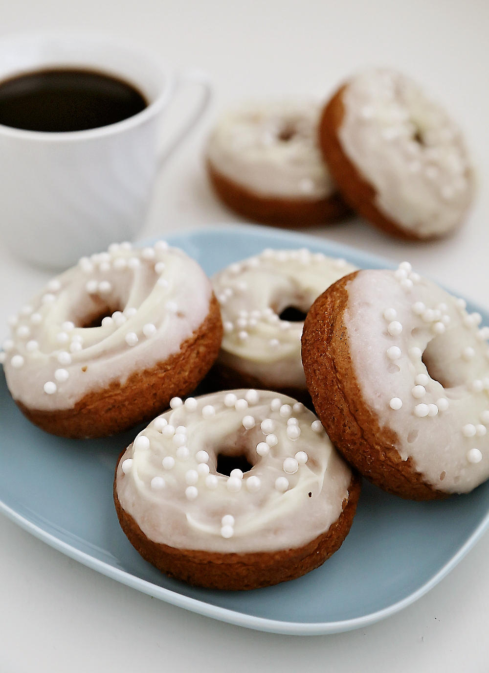 Soft Pumpkin Donuts with Cream Cheese Glaze - Super soft, spiced pumpkin donuts are so fragrant, simple and scrumptious. Baked not fried! Thecomfortofcooking.com