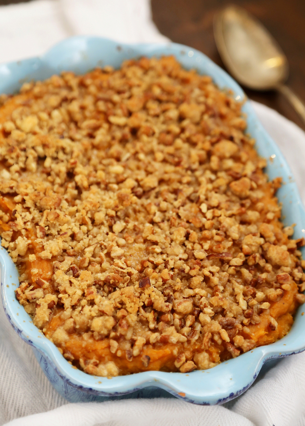 Buttery Brown Sugar Sweet Potato Casserole - Creamy, smooth sweet potato side with streusel topping is easy + sure to hit the spot for holiday feasting! thecomfortofcooking.com