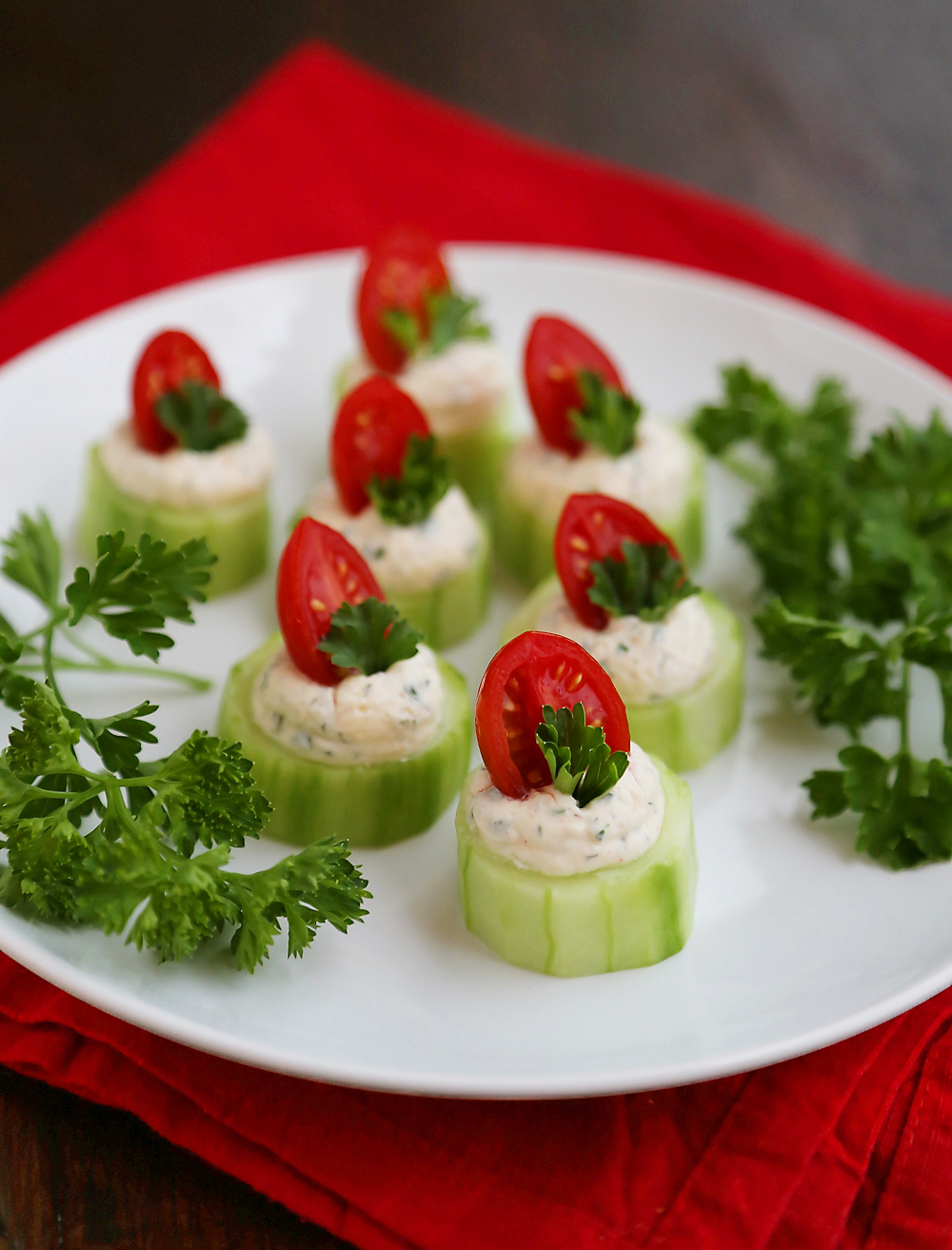 Cucumber Tomato Bites with Creamy Parmesan Herb Spread - Fresh, easy bites with a heavenly homemade herb spread are perfect for holiday and summer parties! Thecomfortofcooking.com