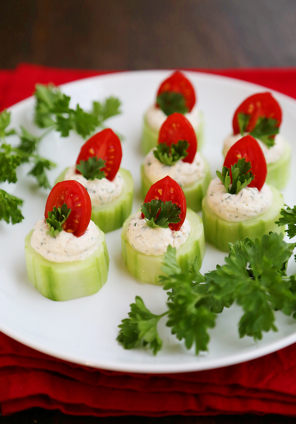 Cucumber Tomato Bites with Creamy Parmesan Herb Spread - Fresh, easy bites with a heavenly homemade herb spread are perfect for holiday and summer parties! Thecomfortofcooking.com