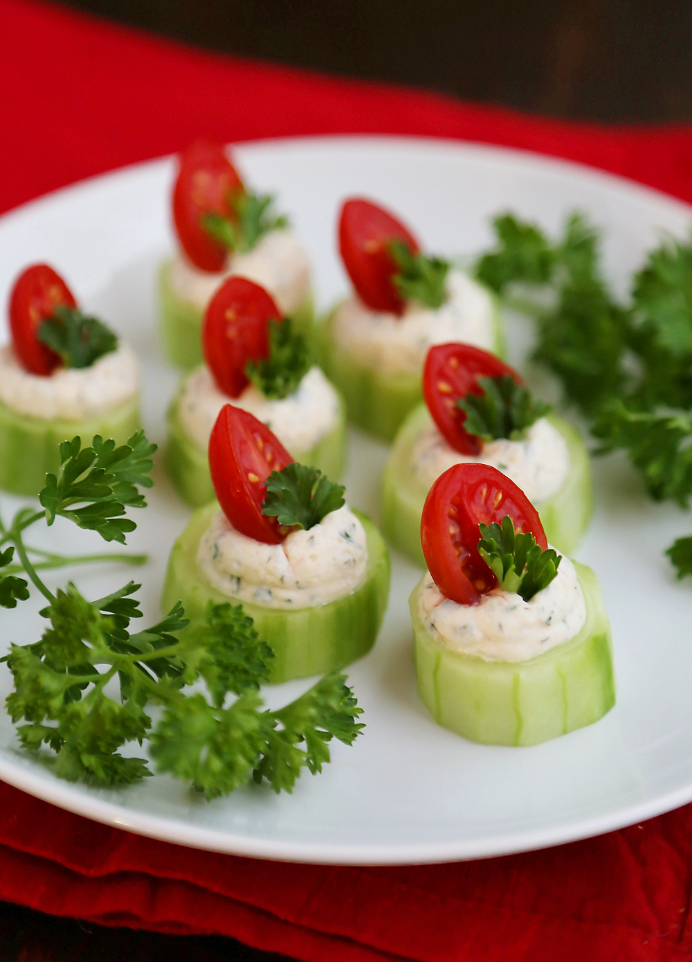 Cucumber Tomato Bites with Creamy Parmesan Herb Spread - Fresh, easy bites with a heavenly homemade herb spread are perfect for holiday and summer parties! Thecomfortofcooking.com