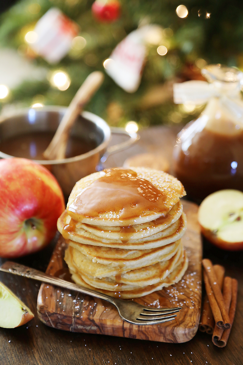 Easy Homemade Apple Cider Syrup – Velvety rich, cinnamon-spiced syrup is perfect on hot pancakes, waffles or French toast. Use in any recipe that calls for maple syrup + give as gifts! Thecomfortofcooking.com