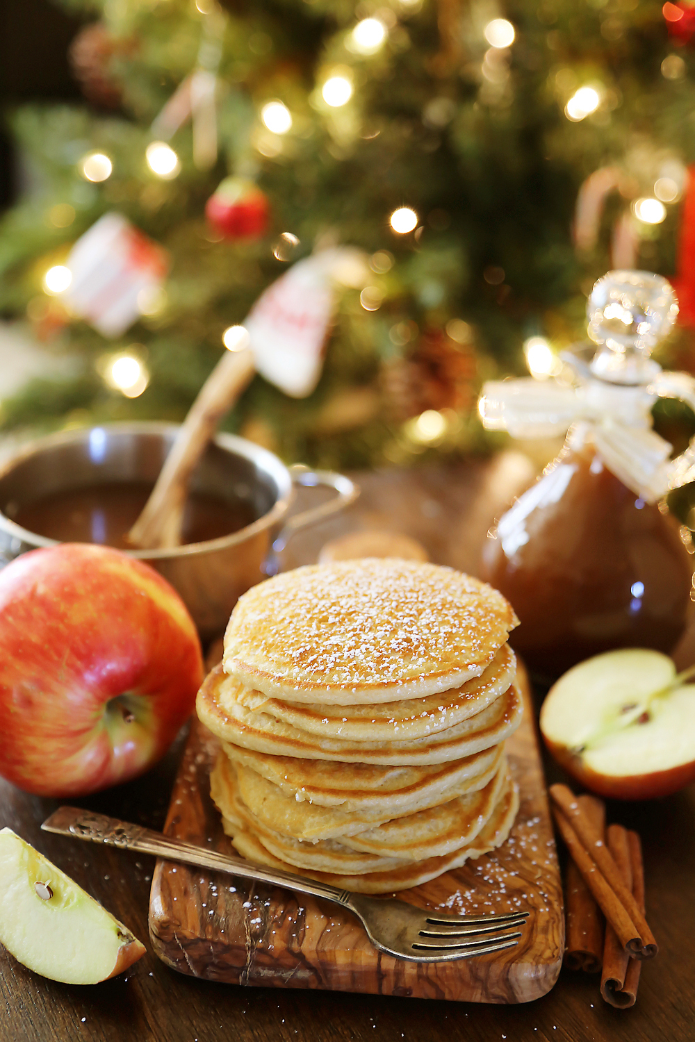 Easy Homemade Apple Cider Syrup – Velvety rich, cinnamon-spiced syrup is perfect on hot pancakes, waffles or French toast. Use in any recipe that calls for maple syrup + give as gifts! Thecomfortofcooking.com