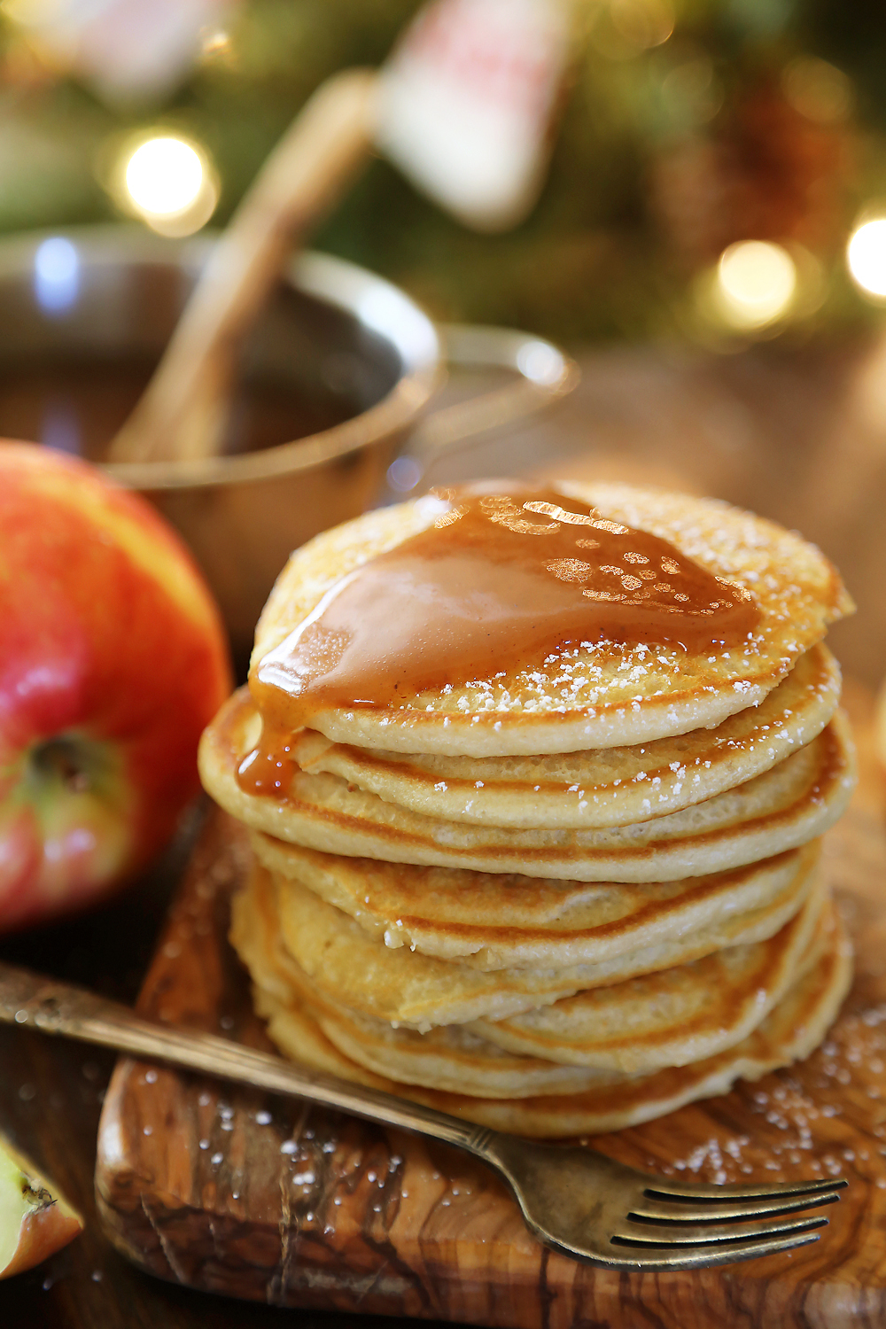 Easy Homemade Apple Cider Syrup – Velvety rich, cinnamon-spiced syrup is perfect on hot pancakes, waffles or French toast. Use in any recipe that calls for maple syrup + give as gifts! Thecomfortofcooking.com