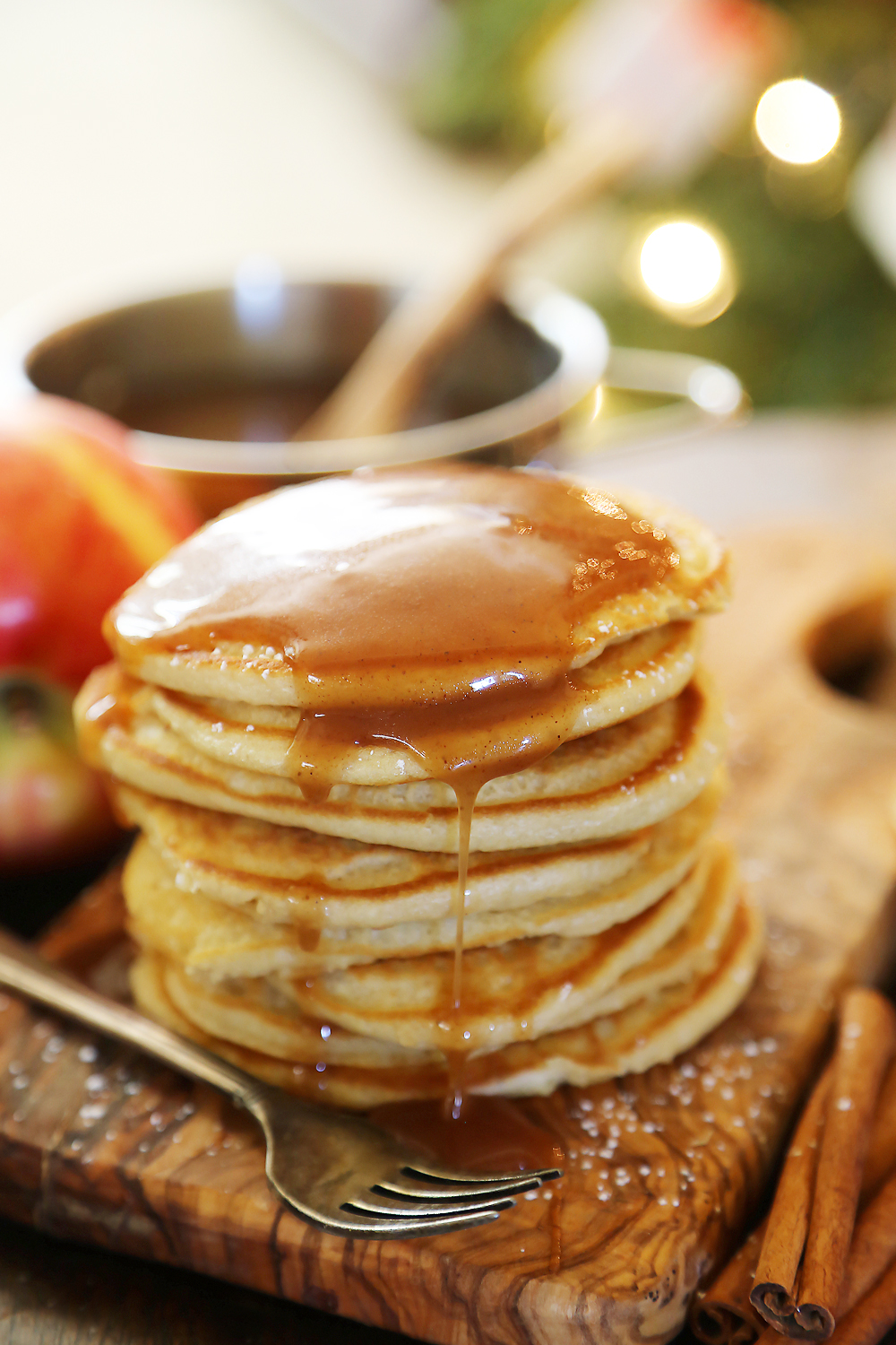 Easy Homemade Apple Cider Syrup – Velvety rich, cinnamon-spiced syrup is perfect on hot pancakes, waffles or French toast. Use in any recipe that calls for maple syrup + give as gifts! Thecomfortofcooking.com