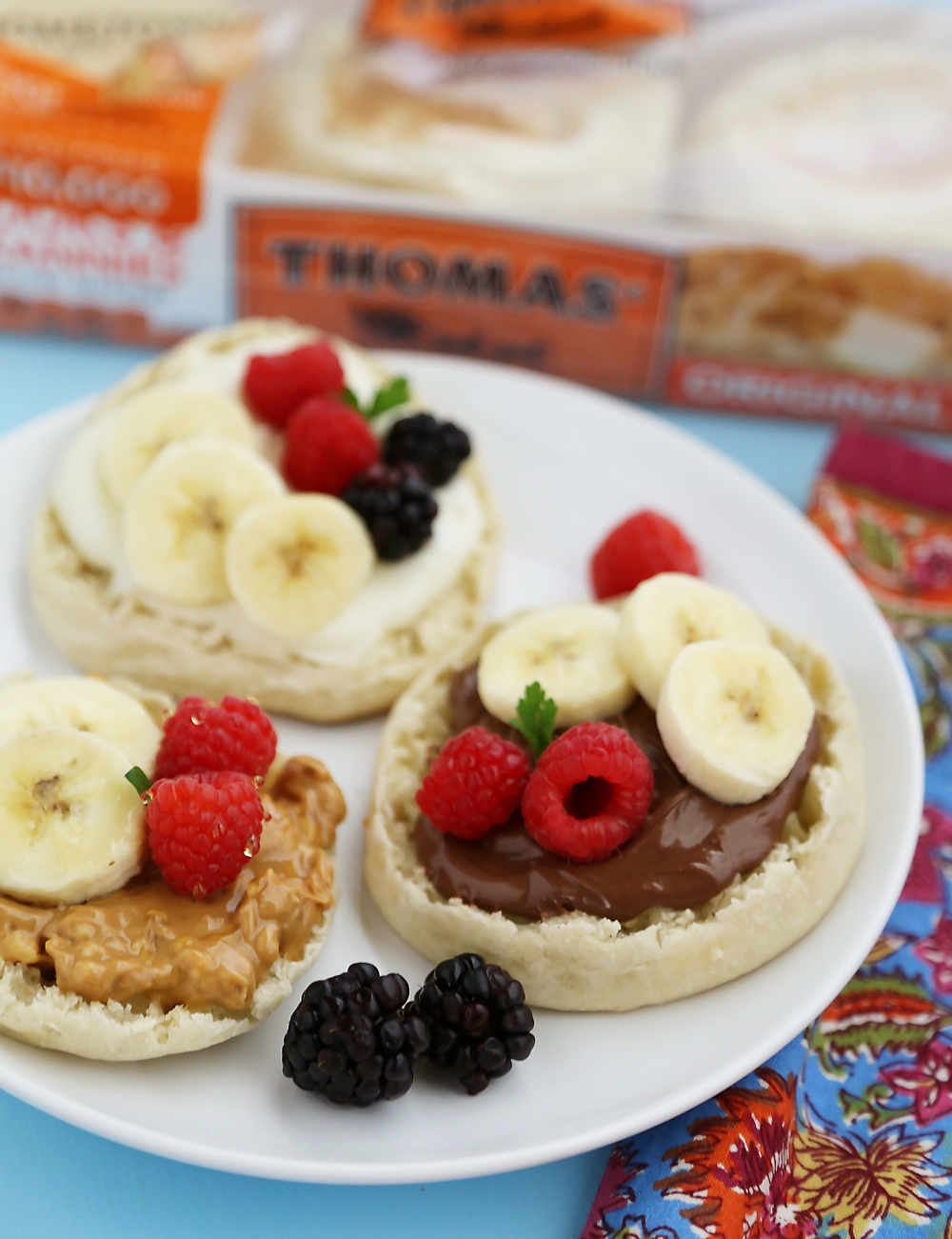 English Muffin Fruit Breakfast Pizzas - Spread with yogurt, Nutella or peanut butter and top with fresh fruit for a delicious morning treat! thecomfortofcooking.com