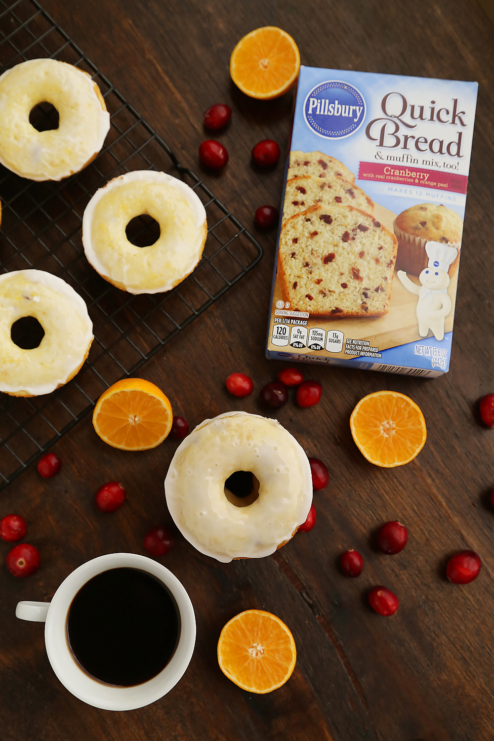 Glazed Cranberry Orange Donuts - Super soft, tangy-sweet donuts with fresh cranberries and orange zest! thecomfortofcooking.com