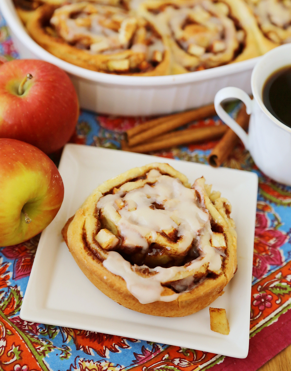 Gooey Apple Pie Cinnamon Rolls - These sticky, soft cinnamon rolls with fresh apples taste like the classic pie and breakfast treat rolled into one! Thecomfortofcooking.com