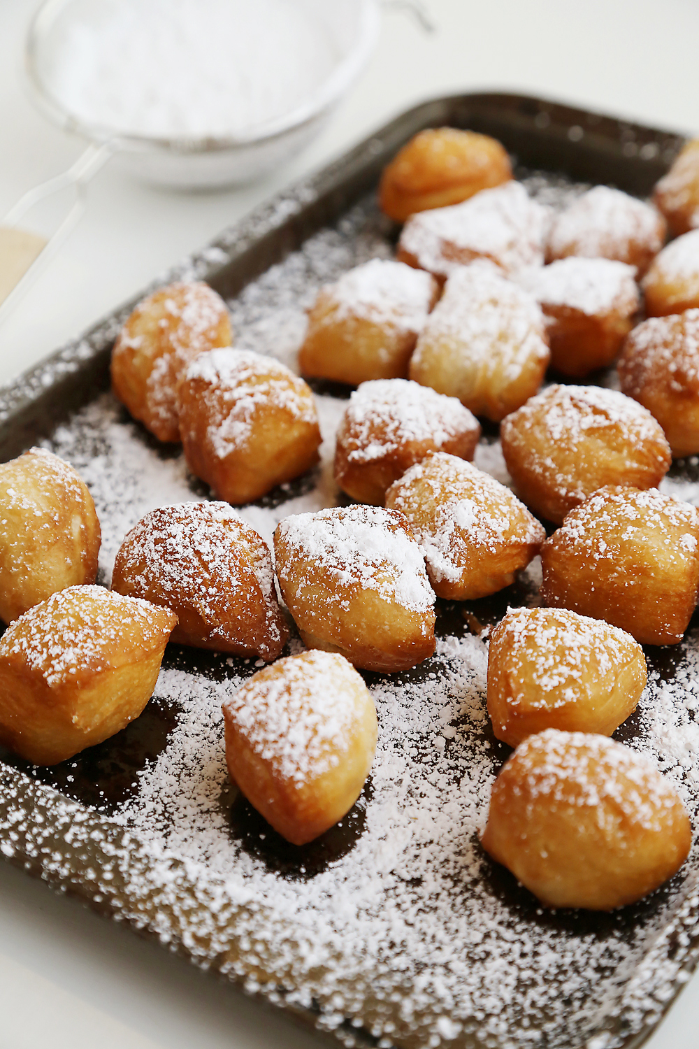 3-Ingredient Beignet Bites - Deliciously fluffy, soft mini beignets made easily for breakfast, brunch or dessert! Thecomfortofcooking.com