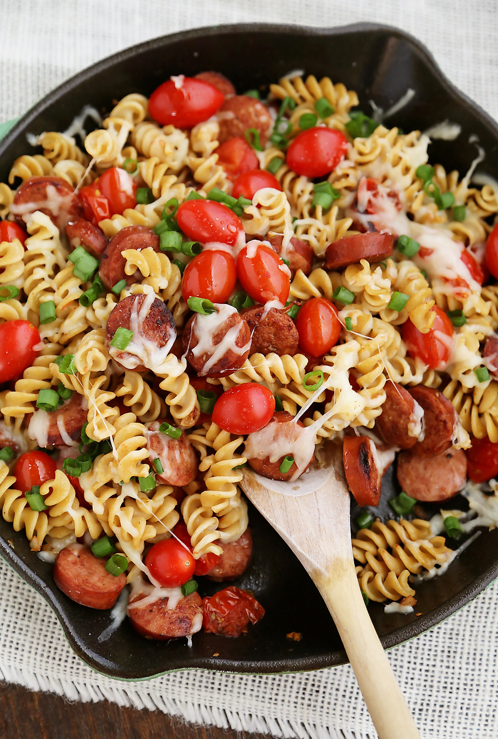 Cheesy Sausage and Tomato Pasta Skillet – This 15-minute dinner is so delicious and easy to whip up on weeknights! Thecomfortofcooking.com