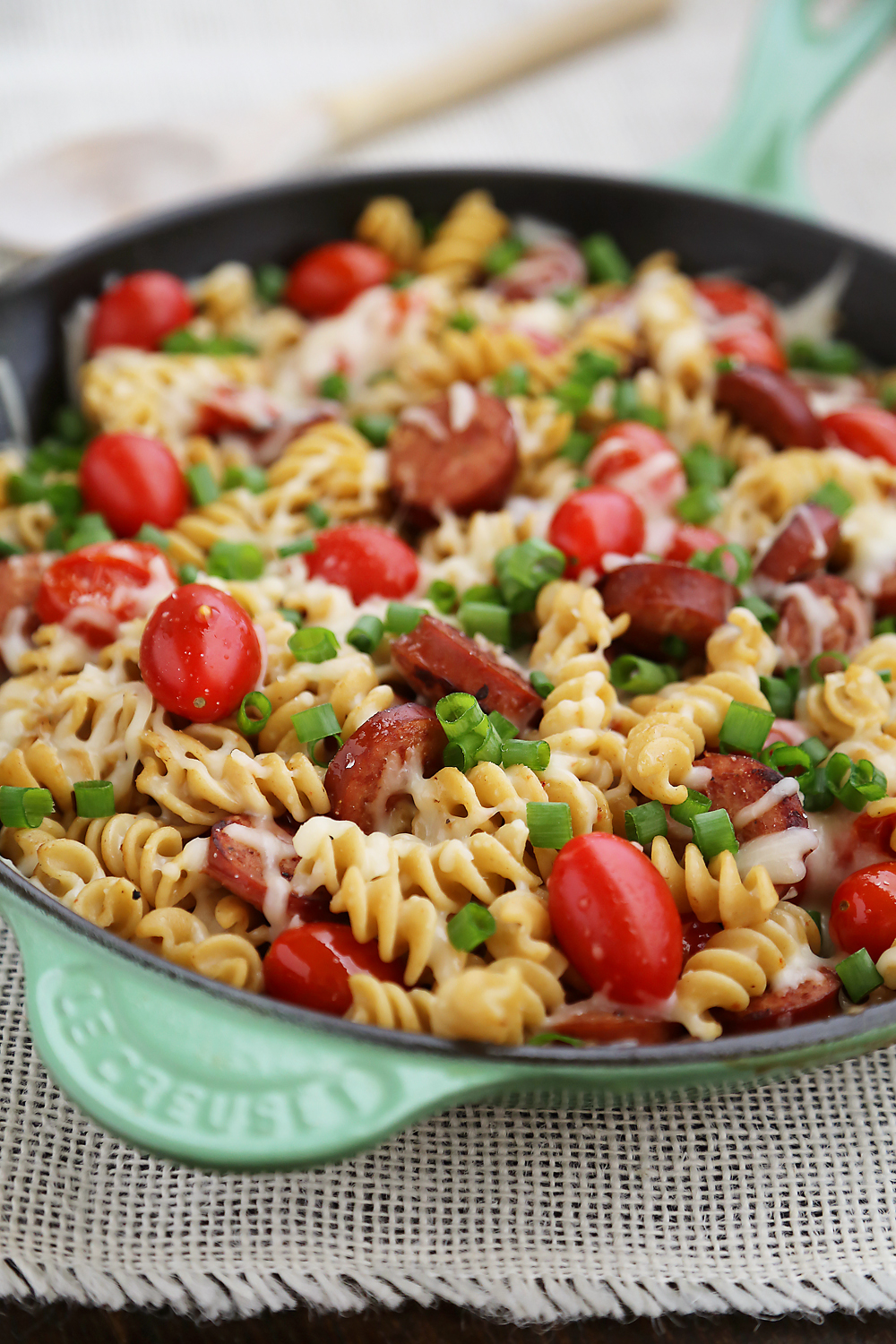 Cheesy Sausage and Tomato Pasta Skillet – This 15-minute dinner is so delicious and easy to whip up on weeknights! Thecomfortofcooking.com