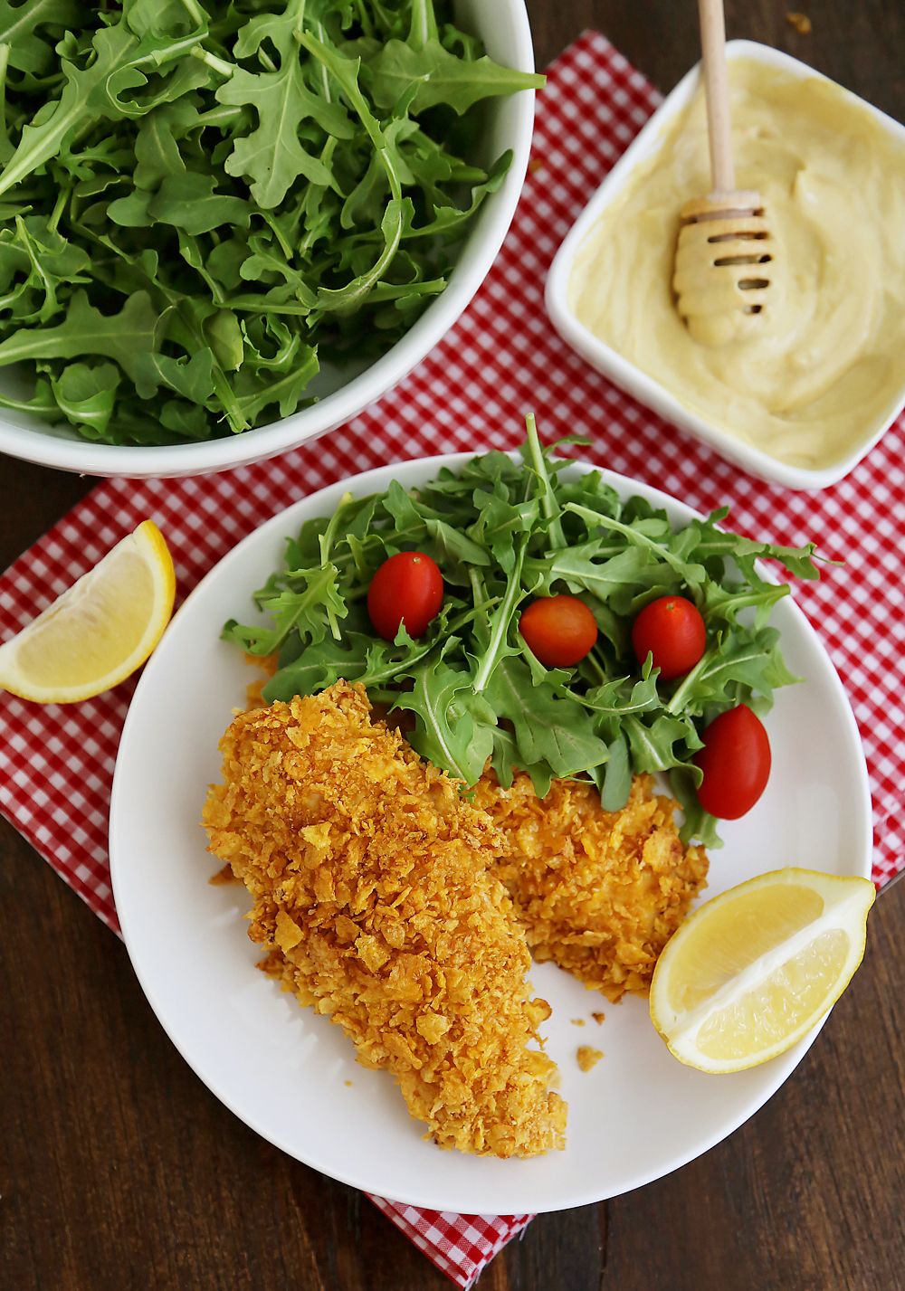 Crispy Honey-Dijon Baked Chicken Tenders - Cornflake crusted chicken with honey mustard dipping sauce (recipe included) makes a perfect weeknight meal that kids and adults will love! Thecomfortofcooking.com