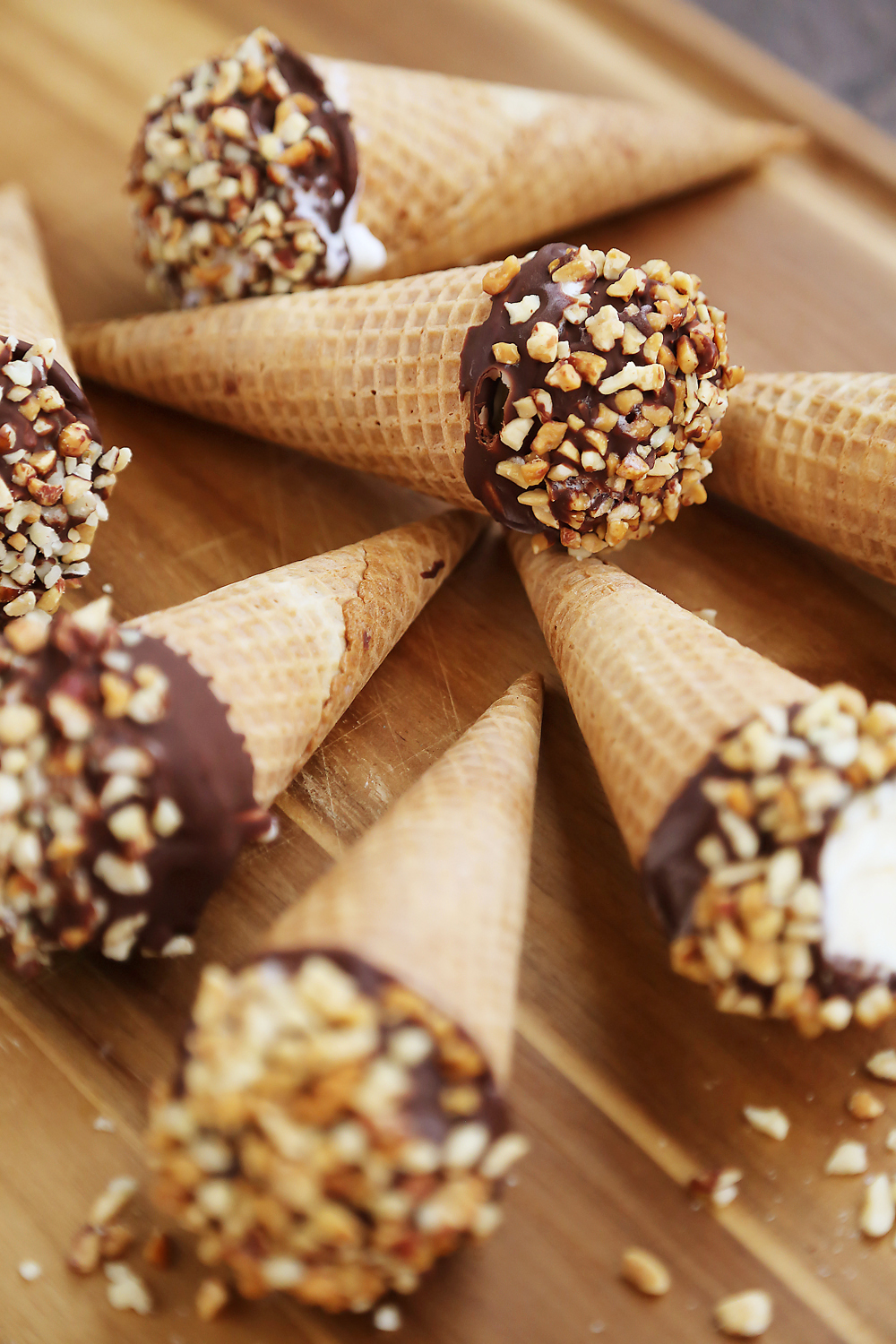 Homemade Vanilla Drumstick Ice Cream Cones – Everyone's favorite frozen treat made at home! These creamy, crisp ice cream cones taste 100x better than store bought. Thecomfortofcooking.com