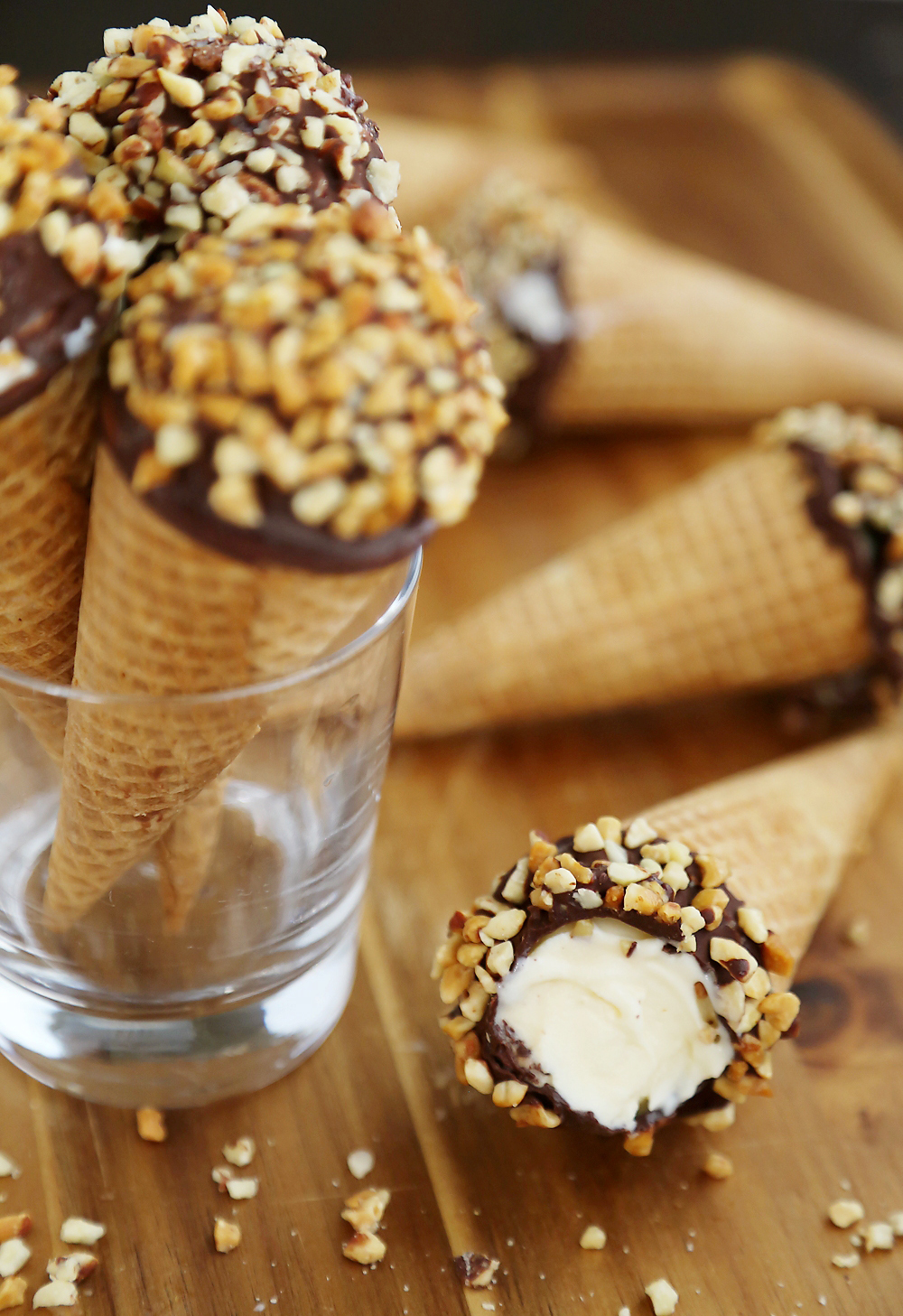 Homemade Vanilla Drumstick Ice Cream Cones – Everyone's favorite frozen treat made at home! These creamy, crisp ice cream cones taste 100x better than store bought. Thecomfortofcooking.com