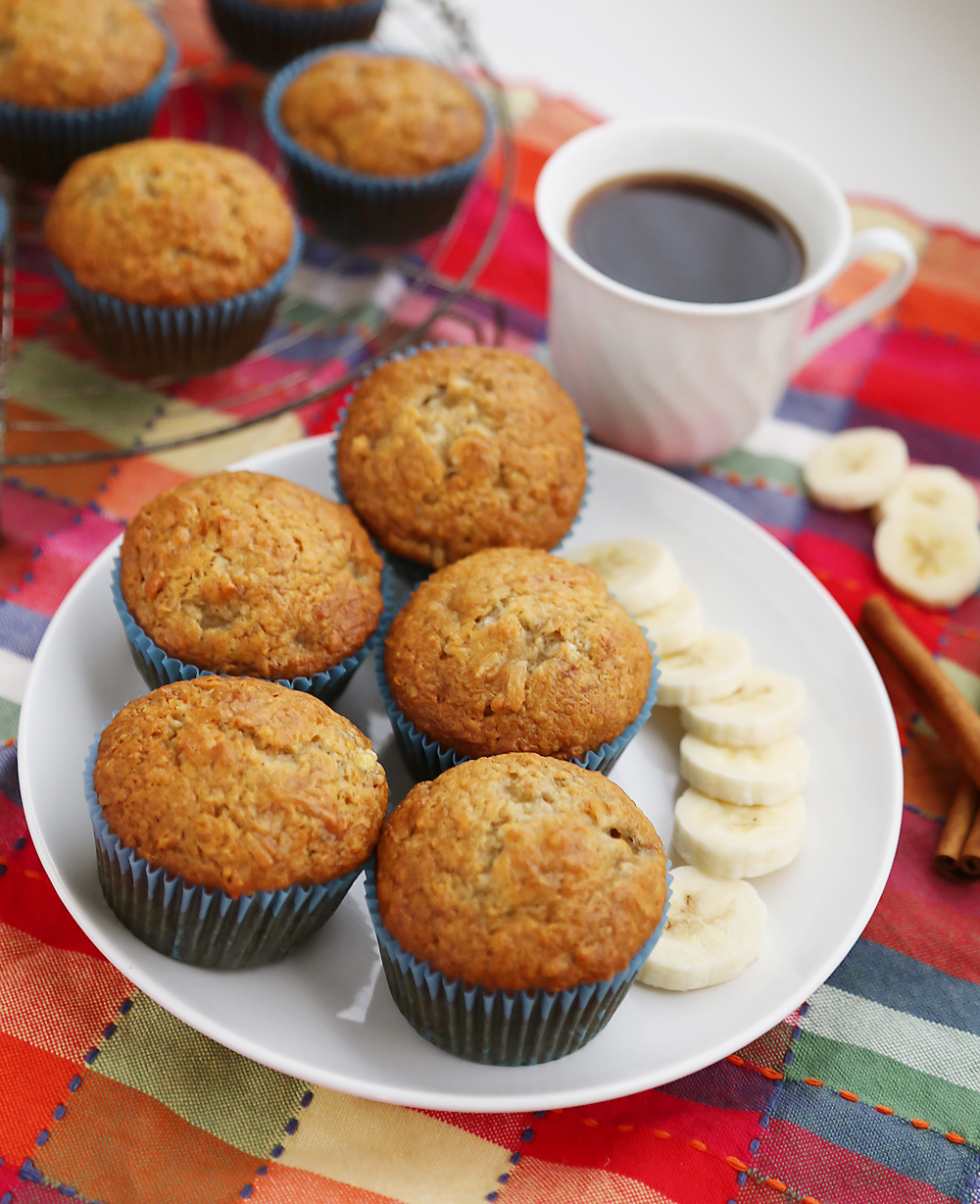 Toasted Coconut Banana Muffins - Super moist, fluffy banana muffins. These make a mouthwatering treat that pairs perfectly with your morning coffee! Thecomfortofcooking.com