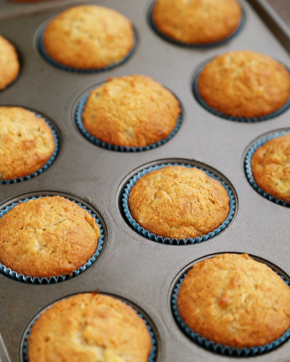 Toasted Coconut Banana Muffins - Super moist, fluffy banana muffins. These make a mouthwatering treat that pairs perfectly with your morning coffee! Thecomfortofcooking.com