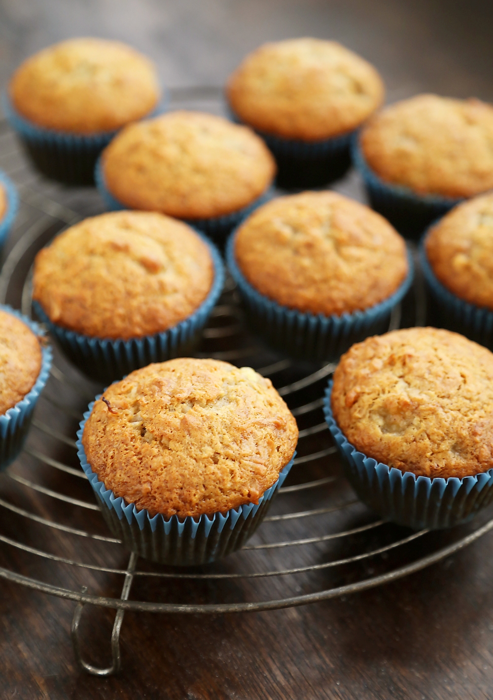 Toasted Coconut Banana Muffins - Super moist, fluffy banana muffins. These make a mouthwatering treat that pairs perfectly with your morning coffee! Thecomfortofcooking.com