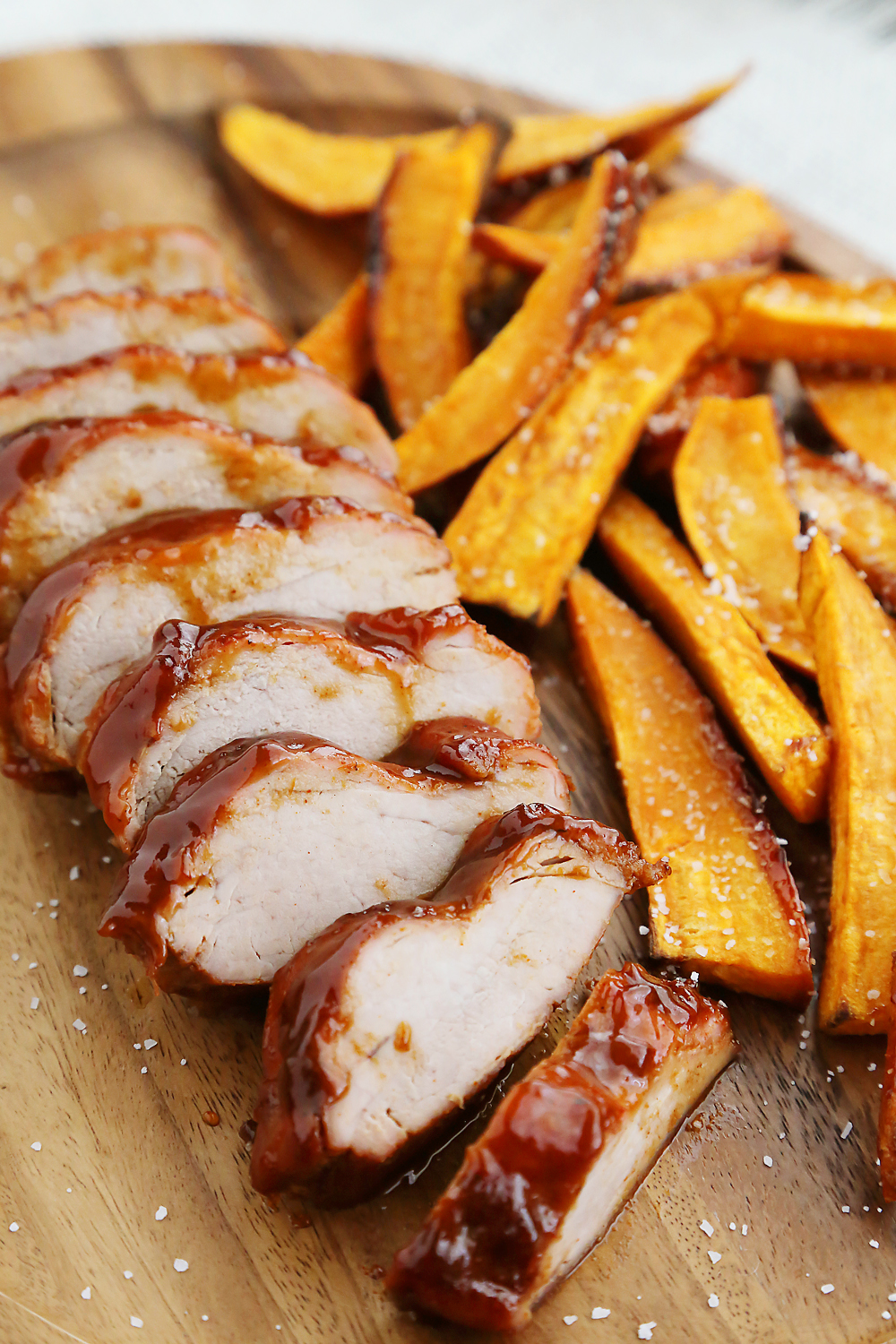 BBQ Pork Tenderloin with Sweet Potato Fries – Try this 5-ingredient one-pan weeknight dinner! So quick, easy and delicious! Thecomfortofcooking.com