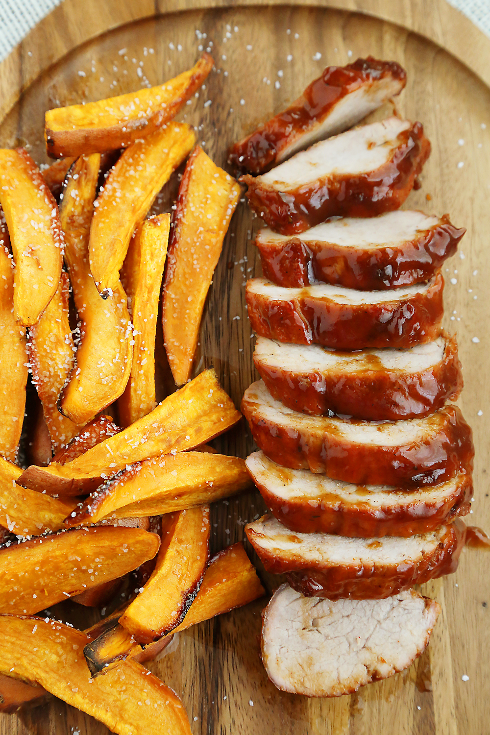 BBQ Pork Tenderloin with Sweet Potato Fries – Try this 5-ingredient one-pan weeknight dinner! So quick, easy and delicious! Thecomfortofcooking.com