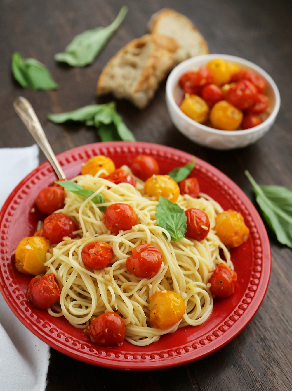 Garlic Roasted Cherry Tomatoes - Stir into pasta or rice, serve on crostini, mix into a frittata, use as a pizza topping, spread on sandwiches, purée into a sauce, or keep them canned up to 2 weeks. Endless possibilities for one perfect-every-time recipe! Thecomfortofcooking.com