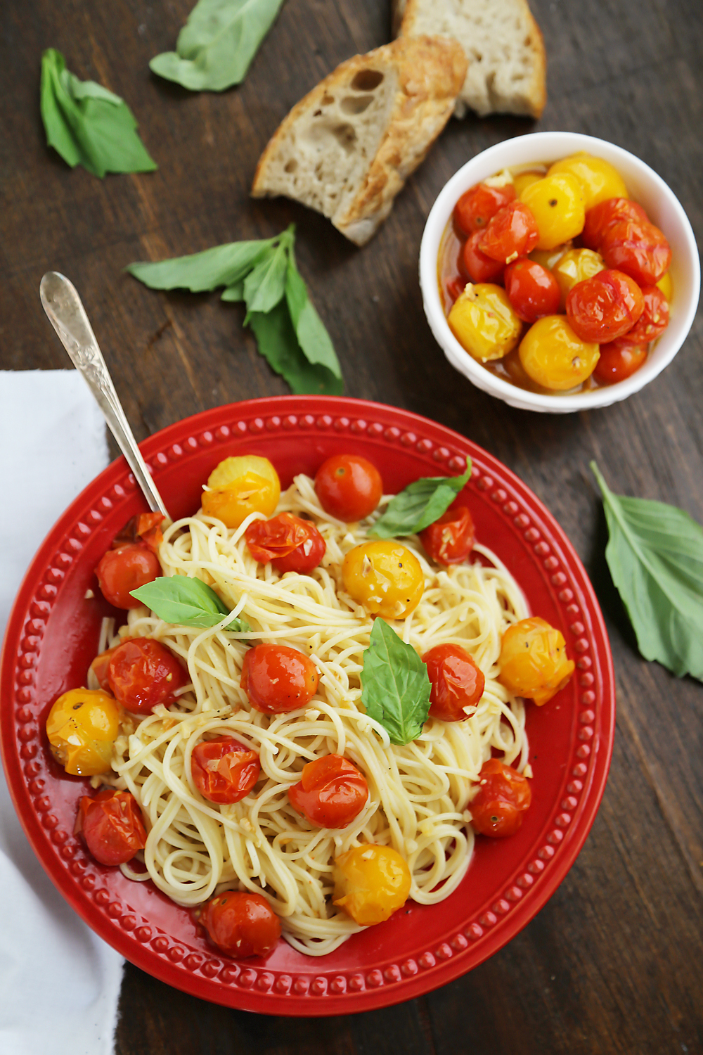 Garlic Roasted Cherry Tomatoes - Stir into pasta or rice, serve on crostini, mix into a frittata, use as a pizza topping, spread on sandwiches, purée into a sauce, or keep them canned up to 2 weeks. Endless possibilities for one perfect-every-time recipe! Thecomfortofcooking.com