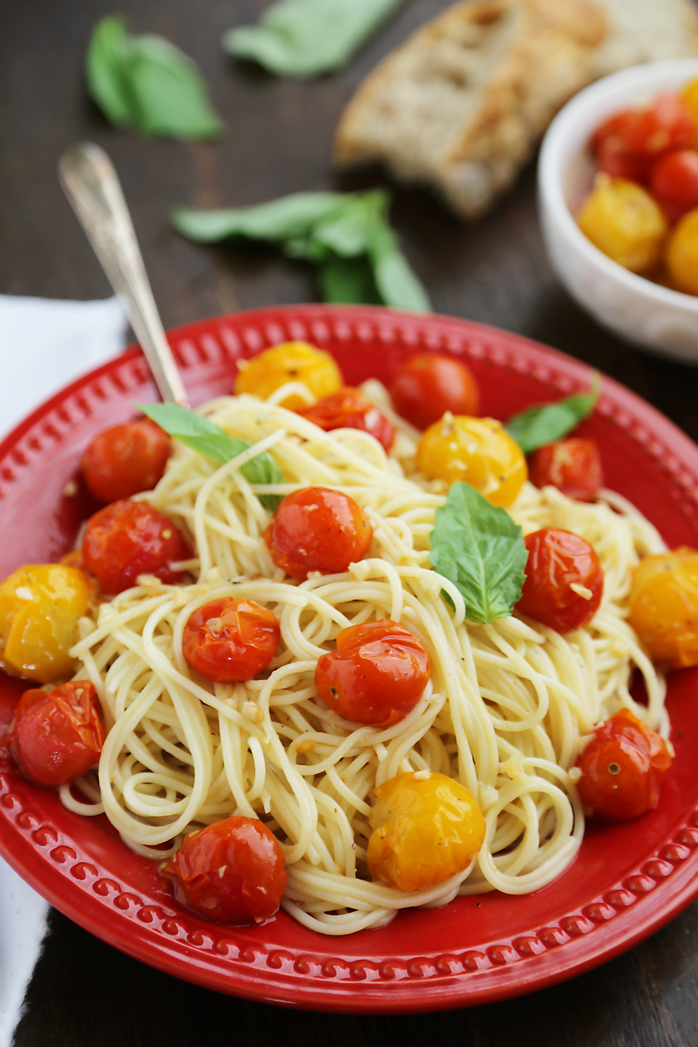 Garlic Roasted Cherry Tomatoes - Stir into pasta or rice, serve on crostini, mix into a frittata, use as a pizza topping, spread on sandwiches, purée into a sauce, or keep them canned up to 2 weeks. Endless possibilities for one perfect-every-time recipe! Thecomfortofcooking.com