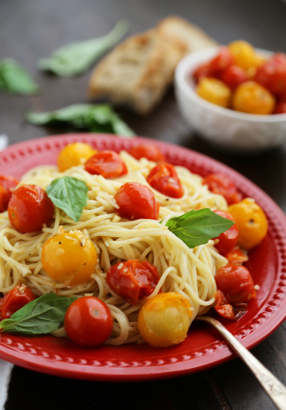 Garlic Roasted Cherry Tomatoes - Stir into pasta or rice, serve on crostini, mix into a frittata, use as a pizza topping, spread on sandwiches, purée into a sauce, or keep them canned up to 2 weeks. Endless possibilities for one perfect-every-time recipe! Thecomfortofcooking.com