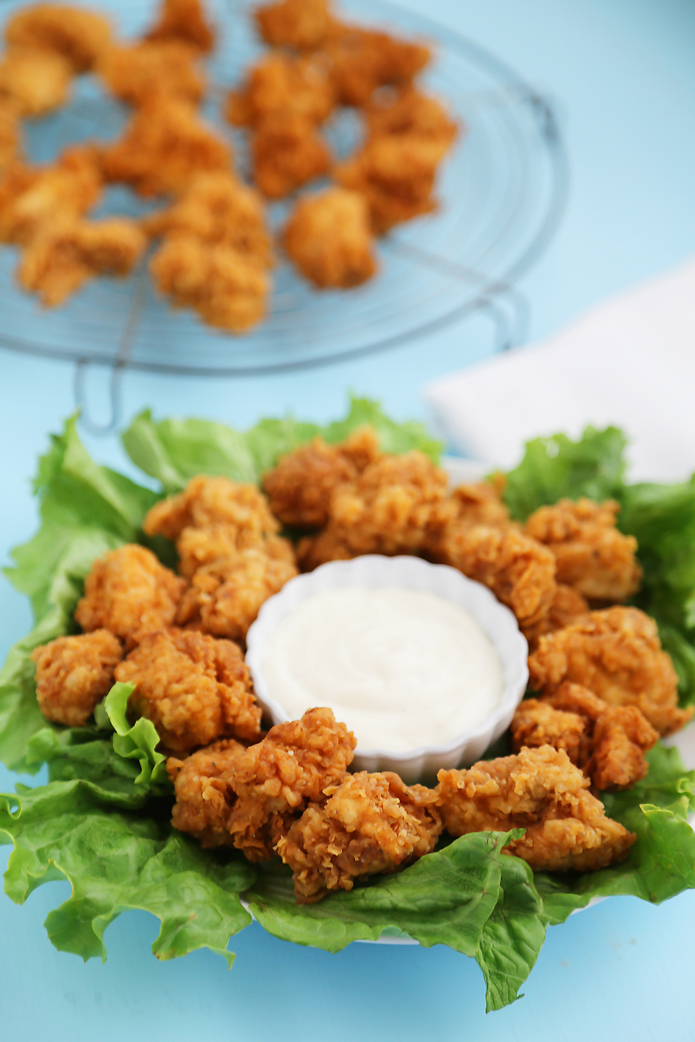 Crispy Buttermilk Popcorn Chicken - Super easy, crispy popcorn chicken made with few ingredients! Serve at parties or for weeknight meals with hot sauce, honey or Ranch dressing. Thecomfortofcooking.com