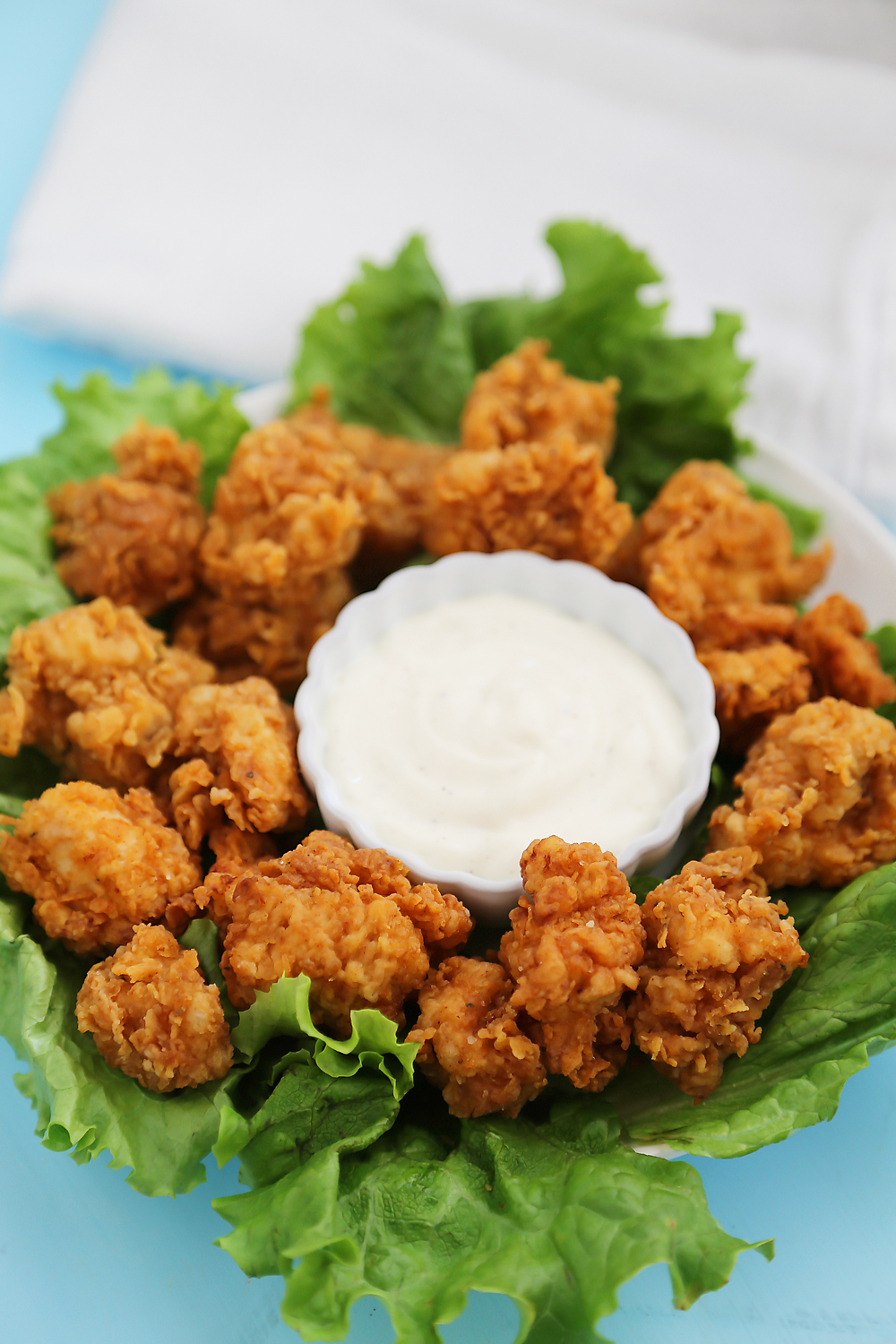 Crispy Buttermilk Popcorn Chicken - Super easy, crispy popcorn chicken made with few ingredients! Serve at parties or for weeknight meals with hot sauce, honey or Ranch dressing. Thecomfortofcooking.com