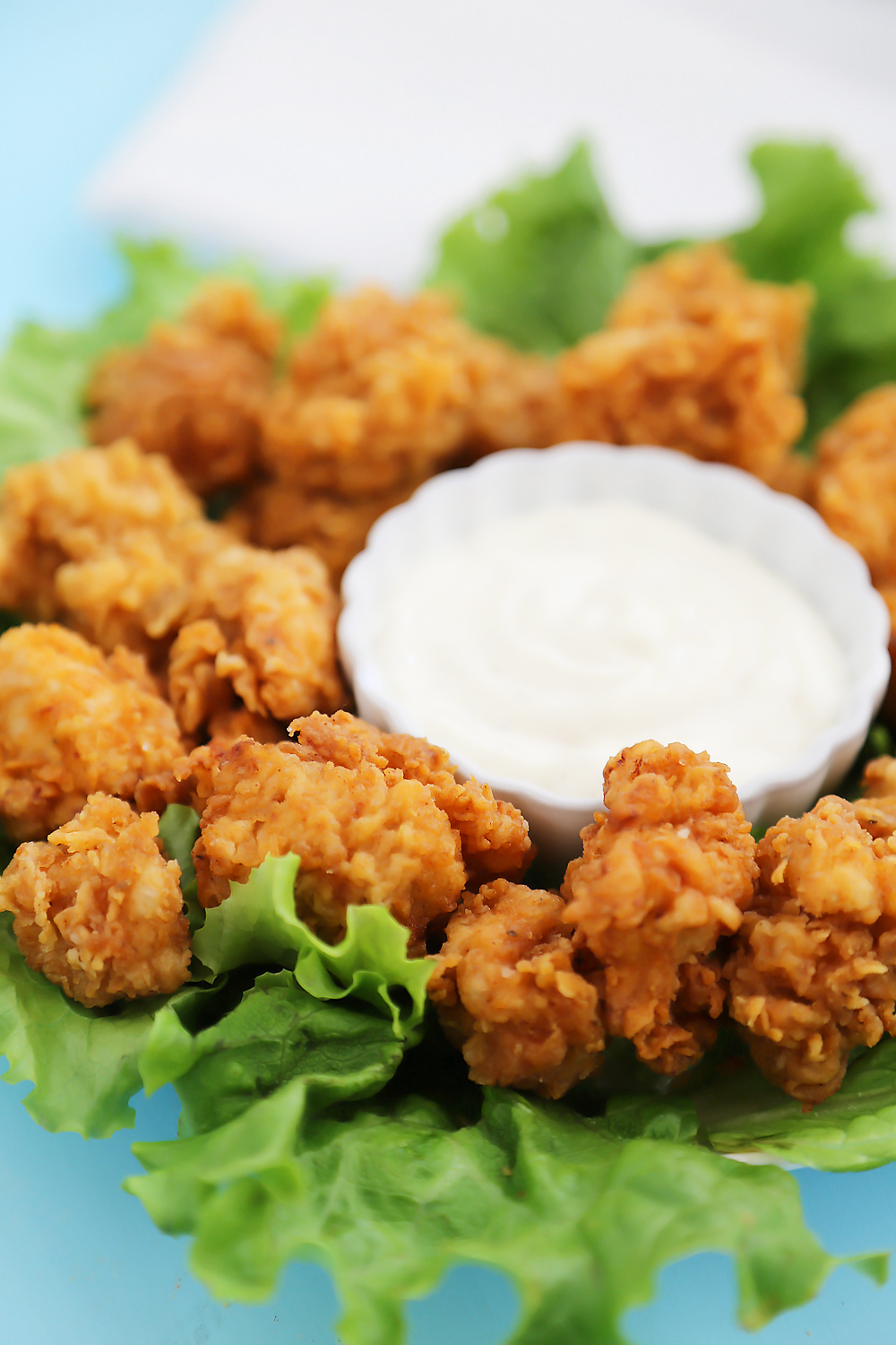 Crispy Buttermilk Popcorn Chicken - Super easy, crispy popcorn chicken made with few ingredients! Serve at parties or for weeknight meals with hot sauce, honey or Ranch dressing. Thecomfortofcooking.com