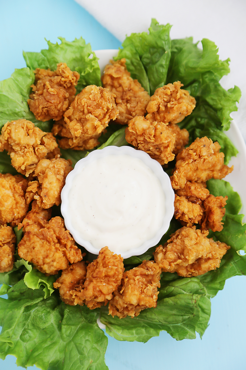 Crispy Buttermilk Popcorn Chicken - Super easy, crispy popcorn chicken made with few ingredients! Serve at parties or for weeknight meals with hot sauce, honey or Ranch dressing. Thecomfortofcooking.com