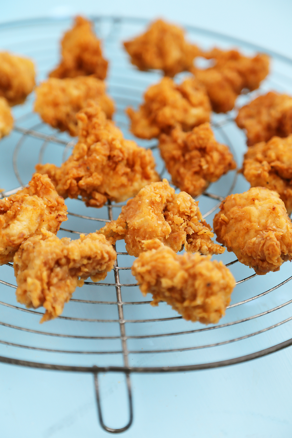 Crispy Buttermilk Popcorn Chicken - Super easy, crispy popcorn chicken made with few ingredients! Serve at parties or for weeknight meals with hot sauce, honey or Ranch dressing. Thecomfortofcooking.com