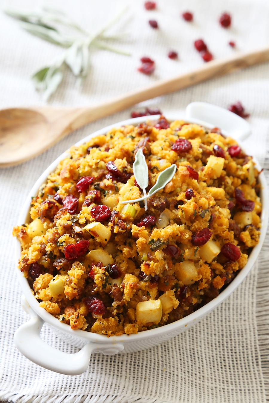 Sausage, Apple and Cranberry Cornbread Stuffing - This savory, delicious stuffing is my all-time favorite comfort food. It's a MUST for Thanksgiving + easy weeknight sides! thecomfortofcooking.com