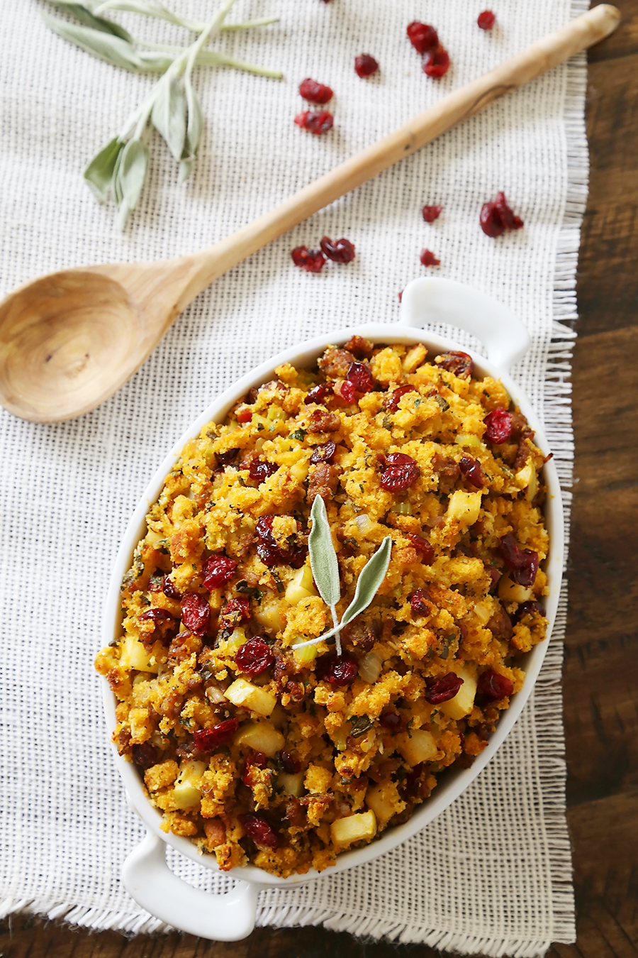 Sausage, Apple and Cranberry Cornbread Stuffing - This savory, delicious stuffing is my all-time favorite comfort food. It's a MUST for Thanksgiving + easy weeknight sides! thecomfortofcooking.com