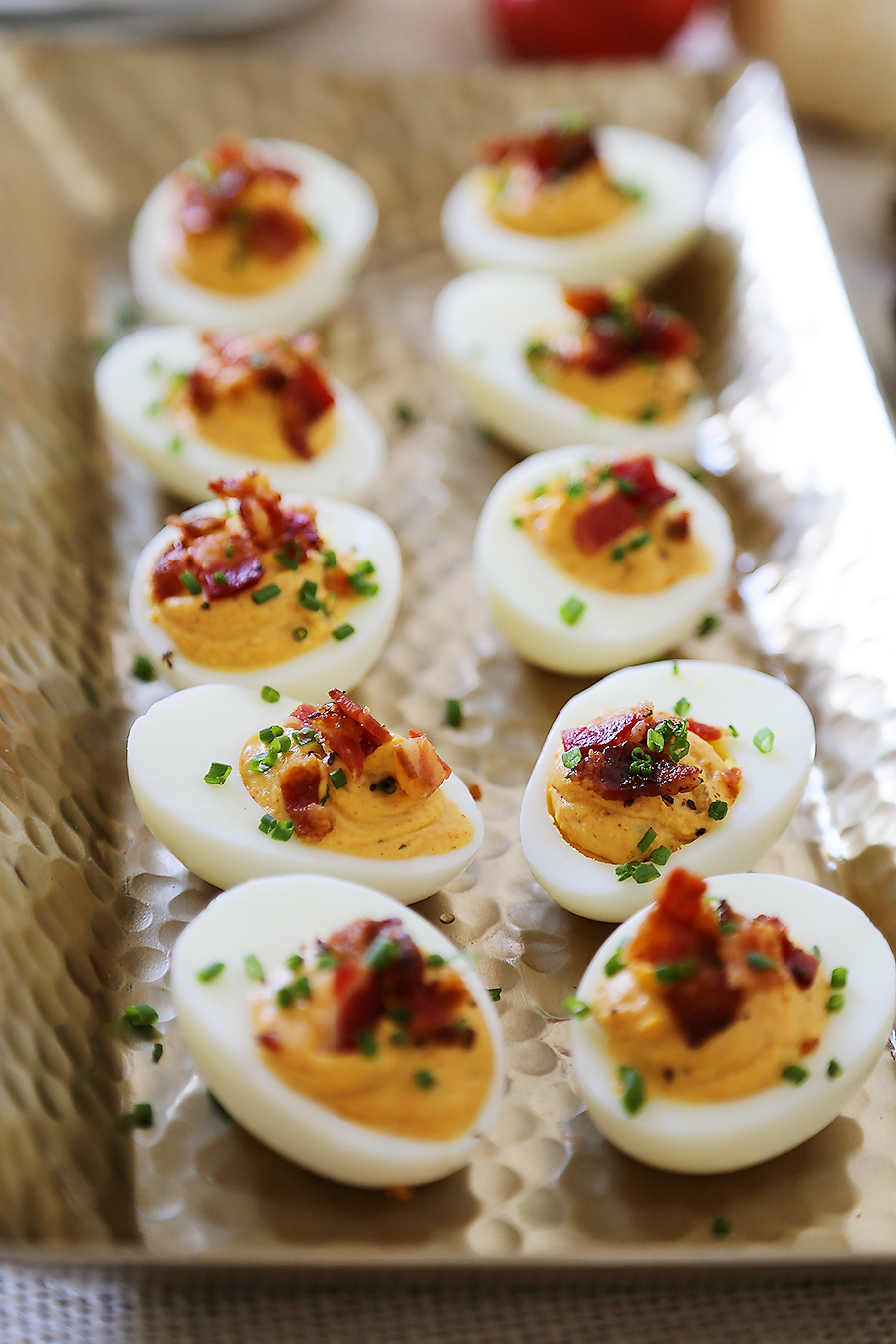 Bacon, Chive + Sour Cream Deviled Eggs - Creamy, crispy and full of flavor! All you need is 20 minutes and a handful of ingredients for the perfect party bite! thecomfortofcooking.com