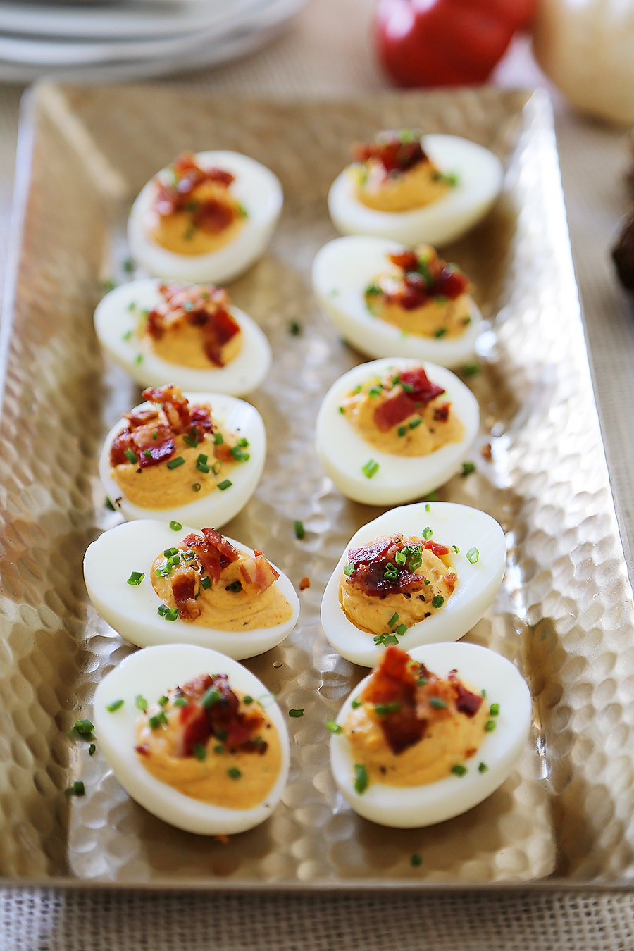 Bacon, Chive + Sour Cream Deviled Eggs - Creamy, crispy and full of flavor! All you need is 20 minutes and a handful of ingredients for the perfect party bite! thecomfortofcooking.com