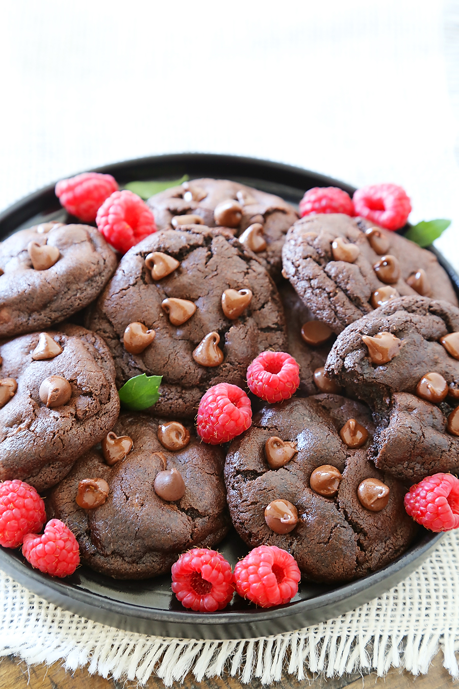 Soft & Chewy Double Chocolate Cookies - These cookies are melt-in-your-mouth good, and so easy to make. Less than 10 ingredients + 10 minutes in the oven! thecomfortofcooking.com