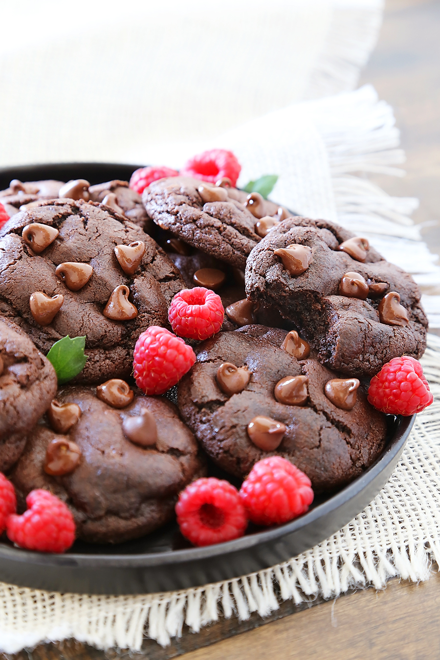 Soft & Chewy Double Chocolate Cookies - These cookies are melt-in-your-mouth good, and so easy to make. Less than 10 ingredients + 10 minutes in the oven! thecomfortofcooking.com