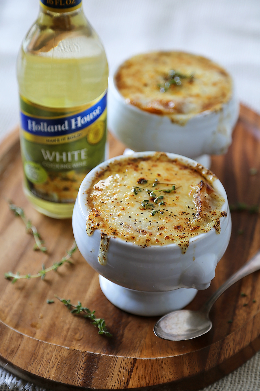 Easy French Onion Soup - Fragrant, cheesy and so comforting! Caramelized onions, beef stock and white (or red) cooking wine mingle into a luxurious medley in this classic French dish. Thecomfortofcooking.com