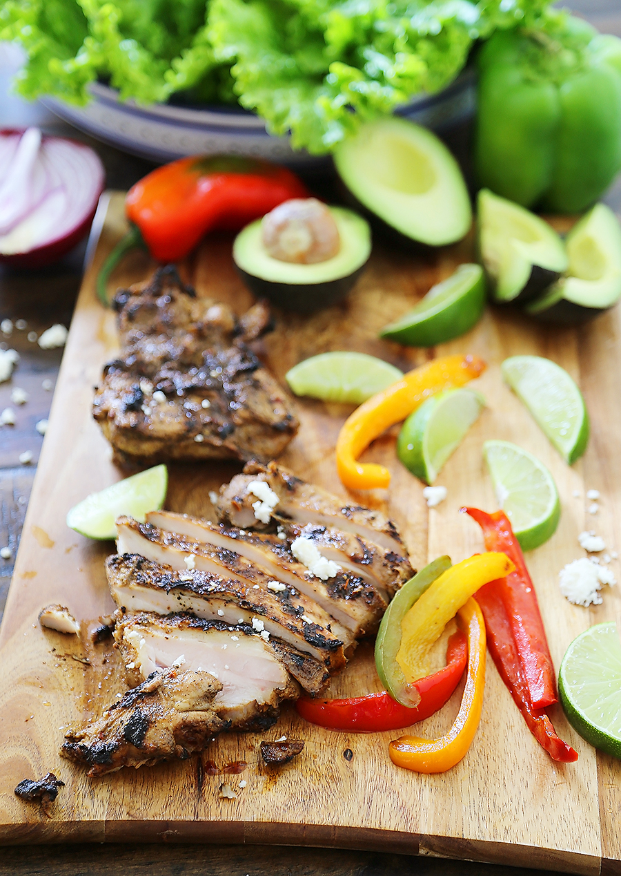 Grilled Chili-Lime Chicken Fajita Salad - Tender, juicy marinated chicken with fresh bell peppers, onions, garlic and avocado slices. SO good. Top with some creamy queso fresco and cilantro for extra eye appeal and flavor! thecomfortofcooking.com